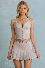 Low-Rise Pleated Mini Skirt in Ecru